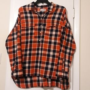 Orange and black flannel half button up.